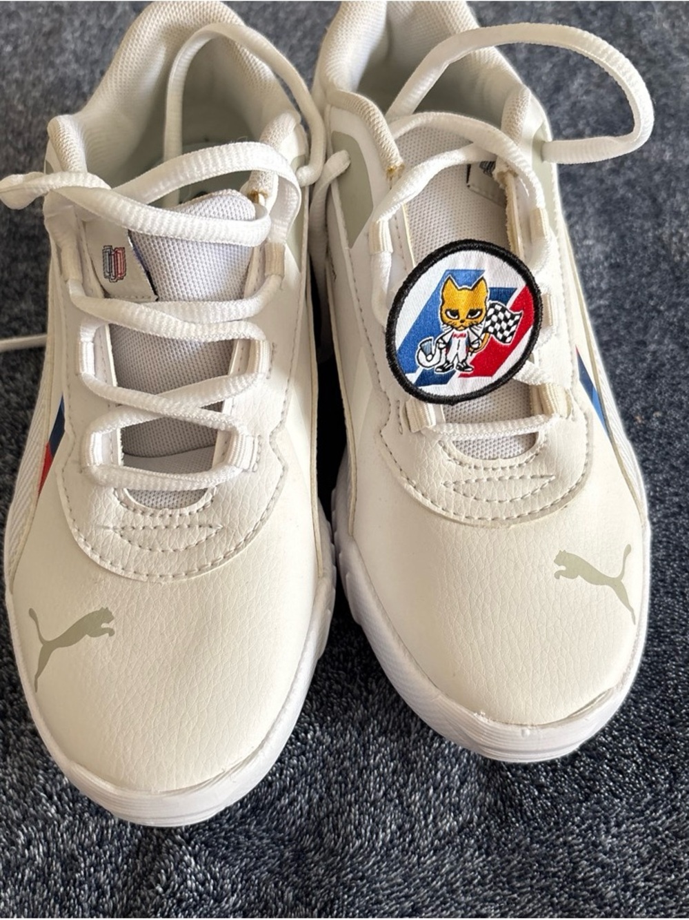Puma Kids White Sneakers with Blue and Red Accents
